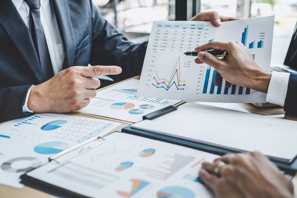 Two executive discussing company growth project success financial statistics, Partner meeting professional investor working start up project for both company with document, laptop and digital tablet.